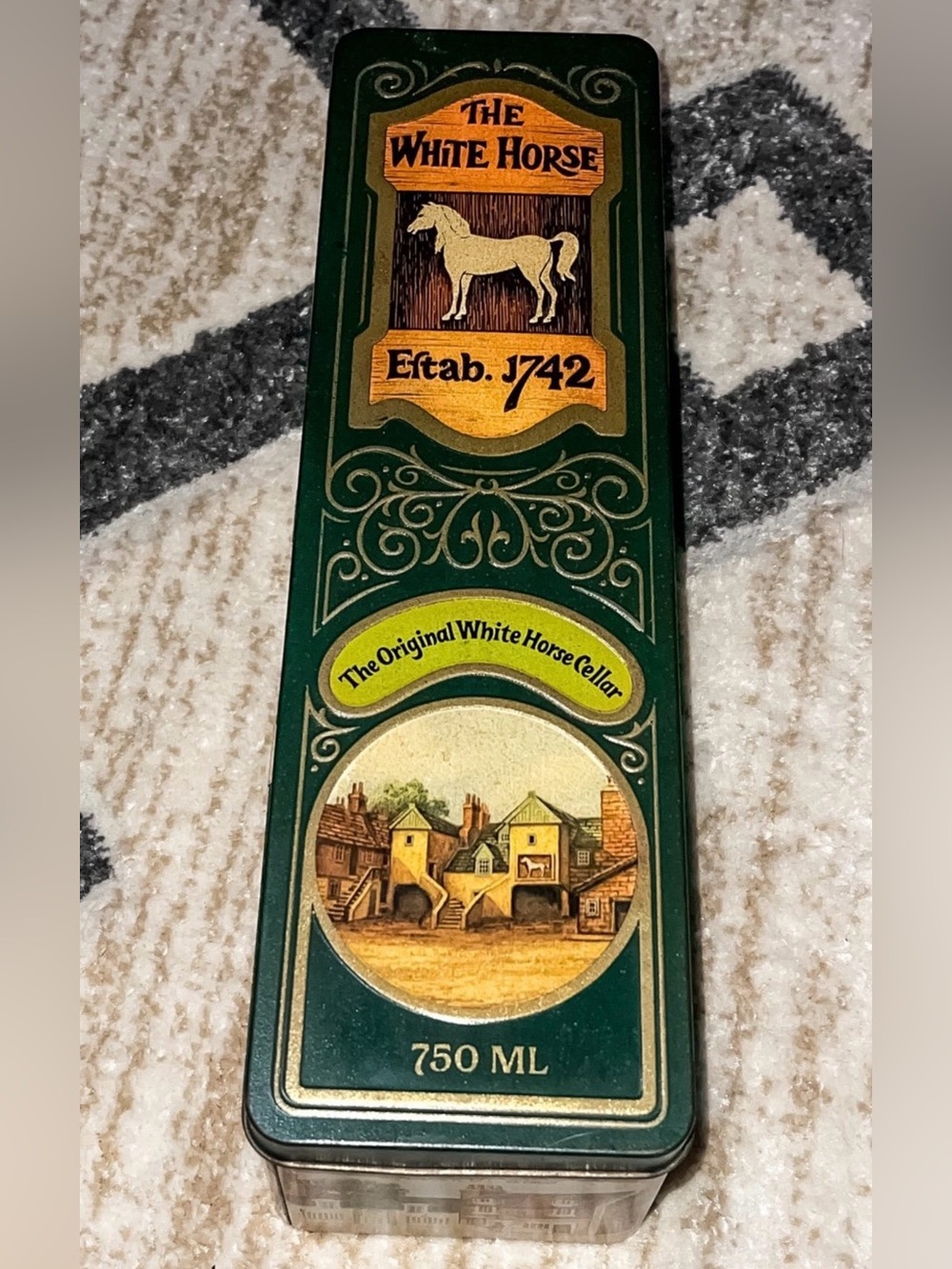 Vintage white horse Scottish whiskey tin. Good condition.